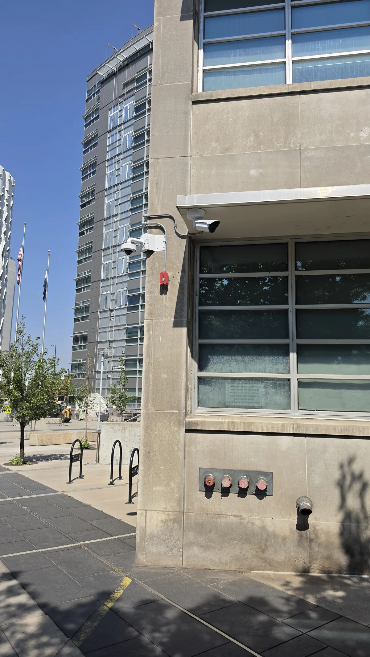Exterior security camera mounted on a multistory building
