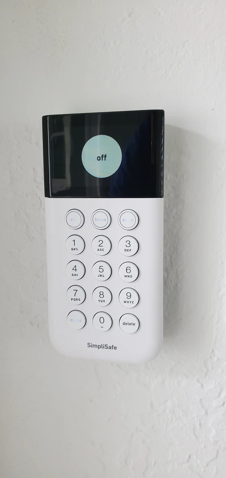 Wall-mounted alarm keypad with numeric controls